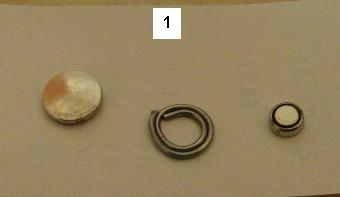 Original battery (left), solder adapter (centre) small replacement battery (right)